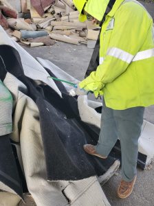 worker testing carpet fiber type